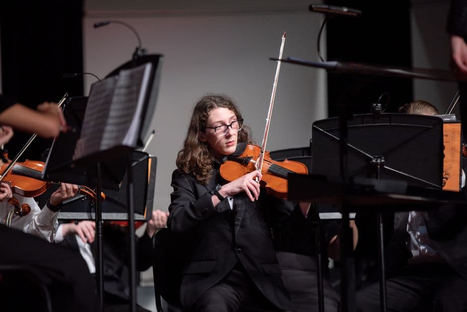 Youth string orchestra players near Suwanee, GA