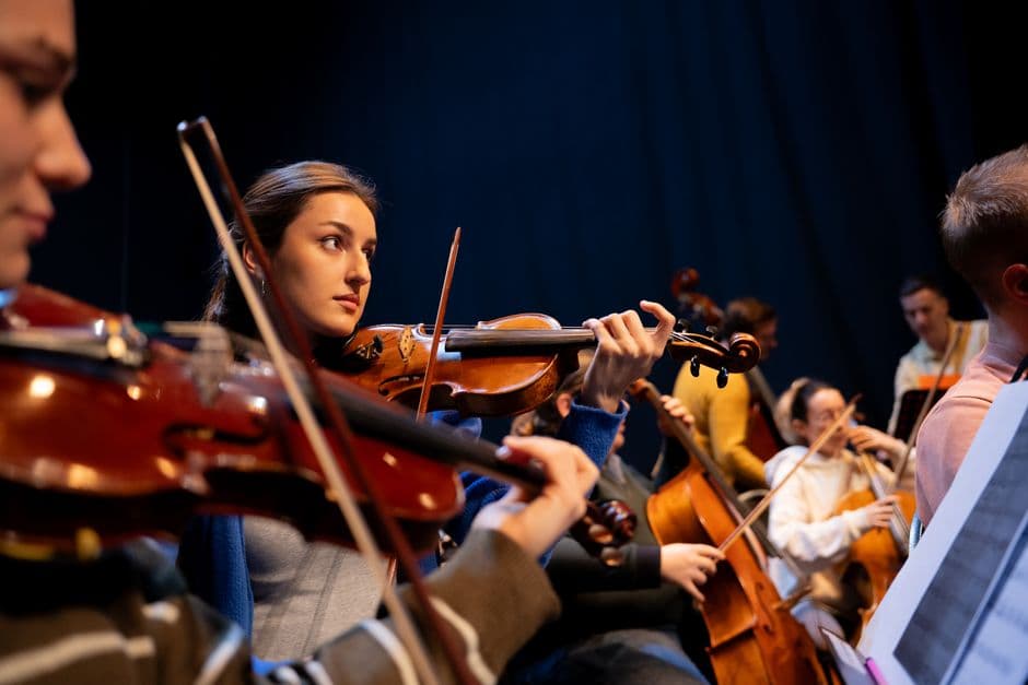 Youth string orchestra players near Berkeley Lake, GA