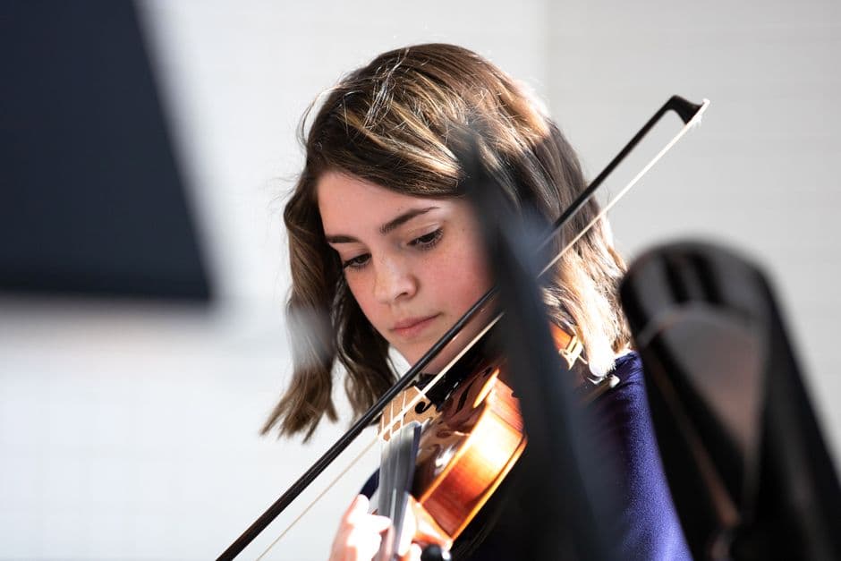 Youth string orchestra players near Duluth, GA
