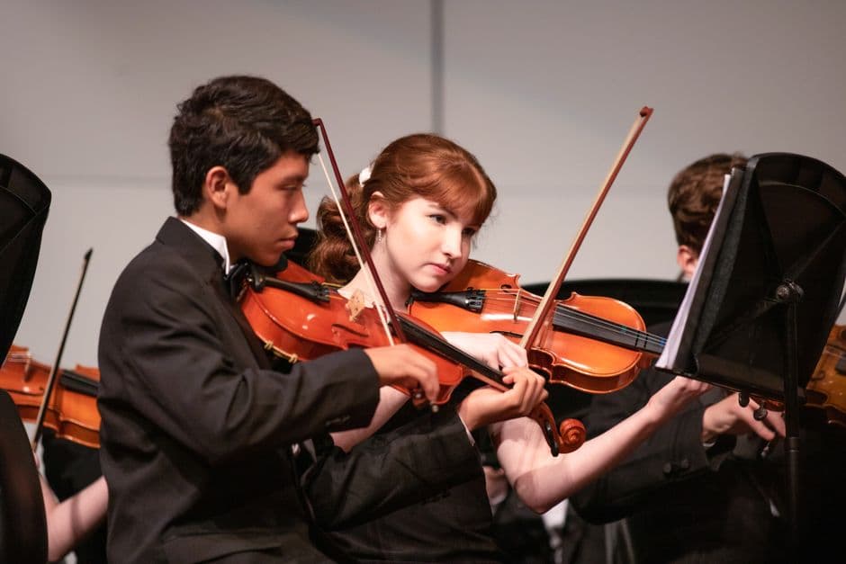 Youth string orchestra players near Suwanee, GA