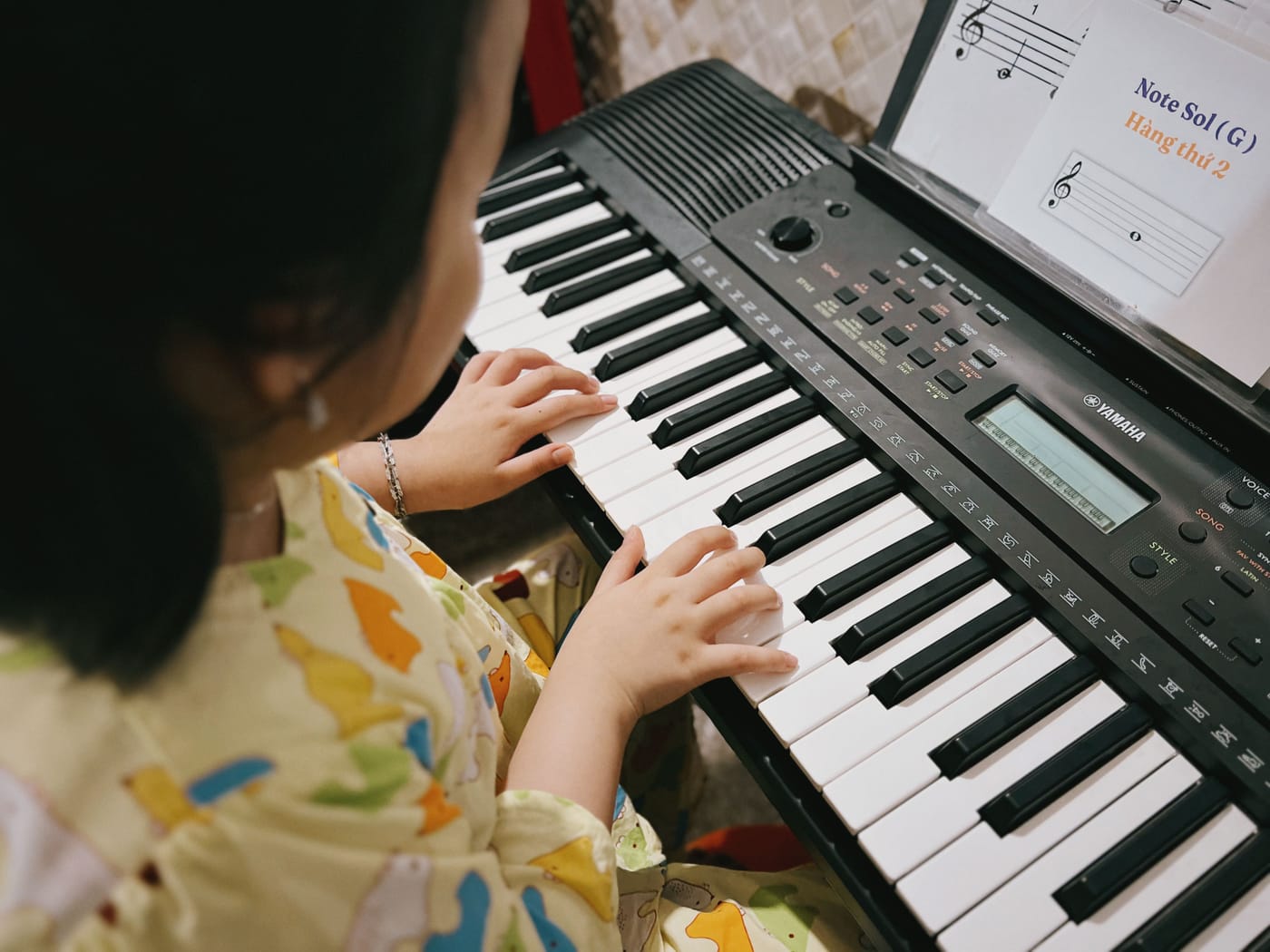 Student practicing on an arranger keyboard