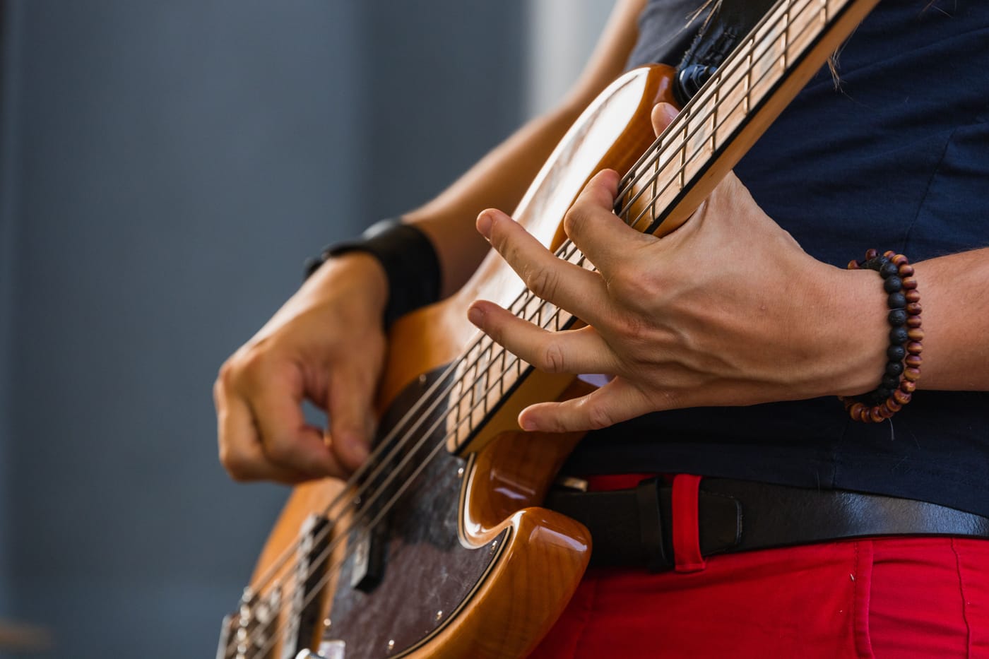 Bass guitar being played across styles